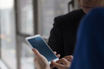 Man is peek mobile phone