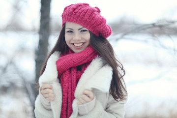 young european model in stylish clothes in the winter forest