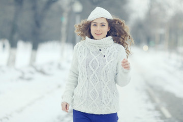 sports running girl in winter sweater