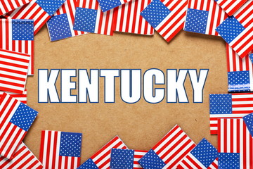 Obraz premium The title Kentucky with a border of USA flags