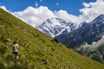 young woman hiking in the caucasus mountains
