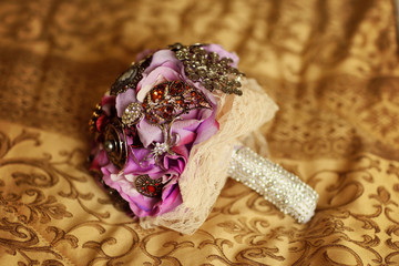 Purple wedding bouquet covered with crystals