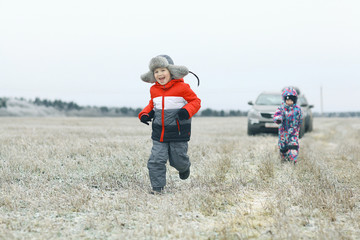 children playing in the winter field