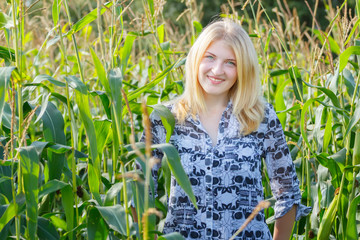 Blonde young woman in corn field © nkarol