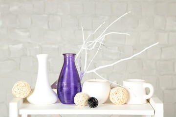 Interior with decorative vases and branch twig