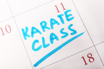 Written plan Karate Class on calendar page background