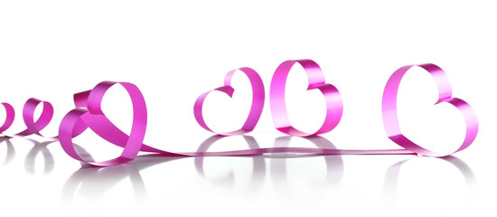 Purple hearts from ribbon isolated on white