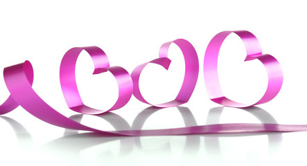 Purple hearts from ribbon isolated on white