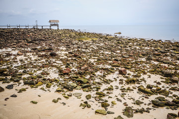 Rock beach and wooden port
