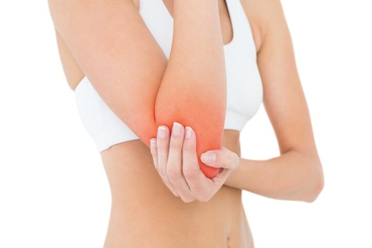 Closeup mid section of a fit woman with elbow pain