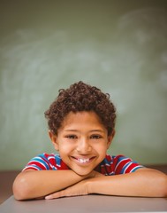 Little boy smiling in classroom