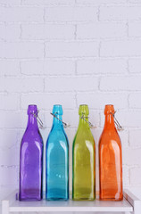 Interior design with colorful decorative glass bottles