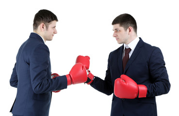 Two handsome businessmen with boxing gloves isolated on white