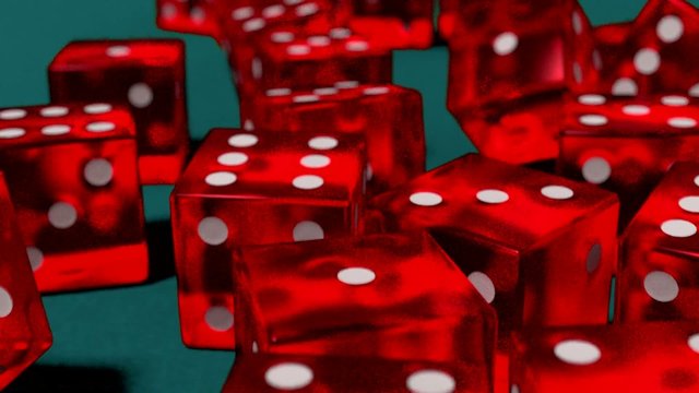 Dice rolling red slow motion closeup DOF on blue felt tabletop