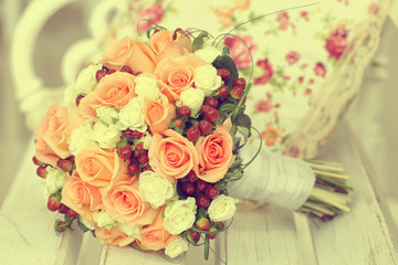 Bouquet of roses on a wooden bench
