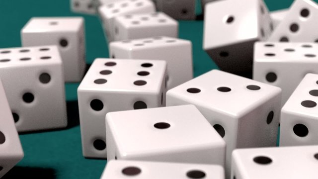 Dice rolling white slow motion closeup DOF on blue felt tabletop