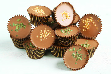 Tasty chocolate candies on wooden table