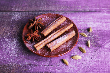 Spices in plate with powdered sugar