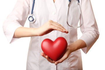 Doctor hands with heart and stethoscope isolated on white