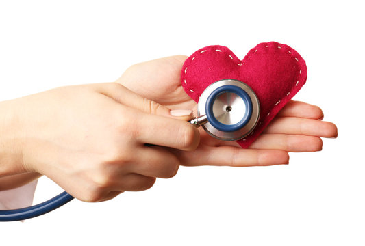 Doctor hands with heart and stethoscope isolated on white