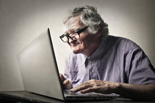 Elderly man using technology
