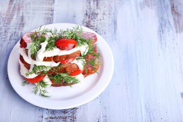 Sandwich with sausage, tomato and mayonnaise