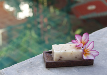 Natural soap with swimming pool background