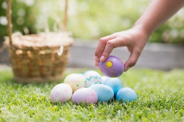 Little girl collecting easter eggs