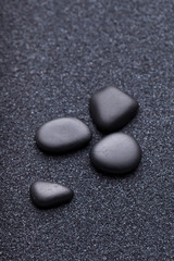 Fototapeta na wymiar Black stones in the relaxing zen garden sand