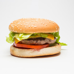 Classic hamburger with salad , cheese and tomatoes