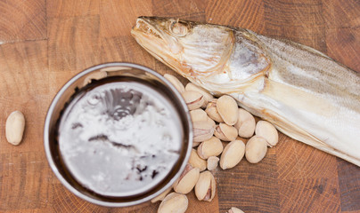 Beer and snacks set: chips, pistachio, shrimp and fish