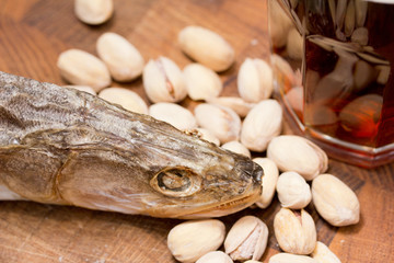 Beer and snacks set: chips, pistachio, shrimp and fish
