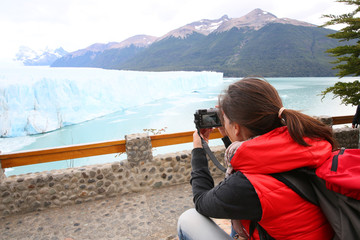 Tourist taking picture of Perito Moreno Glacier