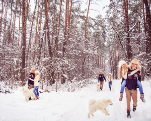 Fototapeta na wymiar boy and girl holding hands, winter walks in the woods