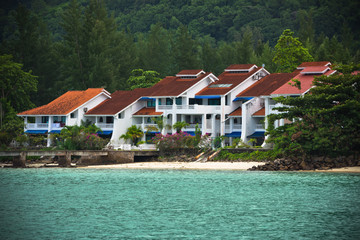 Fototapeta na wymiar Houses on the coastline of Mahe island, Seychelles