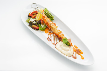 Fried king shrimps on white plate