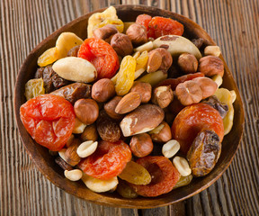 Healthy Mix nuts and dried  fruits on wooden background
