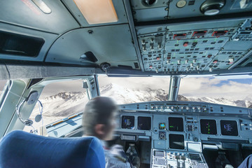 plane cockpit and snow mountain