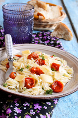 Pasta with sun dried tomatoes, cheese and thyme