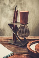 Safety razor and shaving brush on a stand