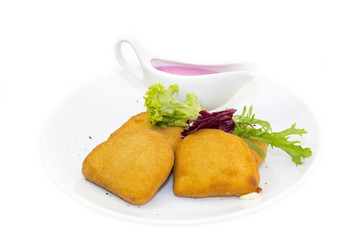 grilled cheese with sauce on a white background