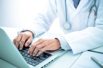 Close-up of a medical worker with laptop