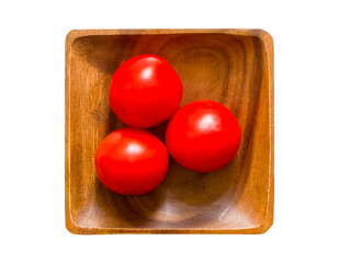 Tomatoes on wooden plate