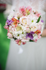 Bride holding a bouquet of beautiful flowers