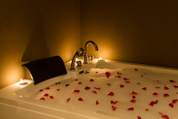 bathtub with candle in spa