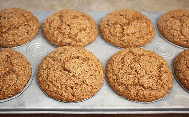 Hot out of the oven - Homemade Bran Muffins in baking pan