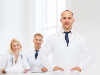 Fototapeta premium smiling male doctor in white coat