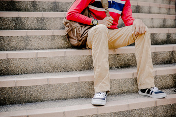 young man sitting on the stairs