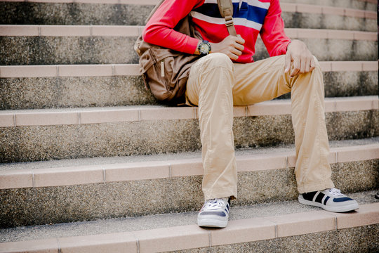 Young Man Sitting On The Stairs