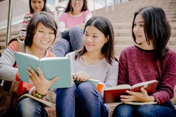 group of happy teen high school students outdoors